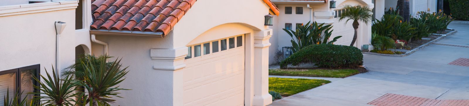 Modern residential garage doors with sunlit driveways in Antelope, California.