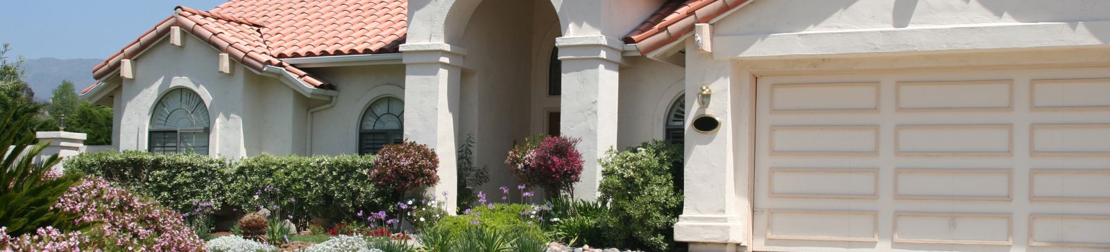 Beautiful Antelope home with landscaped garden and automatic garage door in daylight.