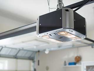 Close-up of a modern garage door opener installed inside a residential Antelope garage.